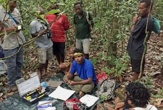 Setting up equipment for bird point counts.