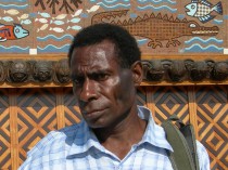 Filip Damen, the leader of Wanang conservation, in from of the PNG Parliament in Port Moresby.